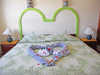 Guest bedroom has two twin beds put together as a king.