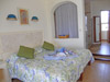 Master bedroom has king-sized bed, ceiling fan, A/C and flat-screen TV with DVD.