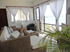 Living room has an open floor plan with door opening to the covered balcony.