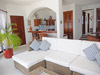 Open floor plan living room has TV with DVD.