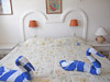 Guest bedroom has two twin beds put together as a king.