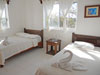 Guest bedroom has a twin bed and a full-sized bed.