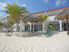 Vista del Mar's white sand beach has lounge chairs and thatched palapas.
