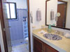 Guest bathroom with tiled shower.